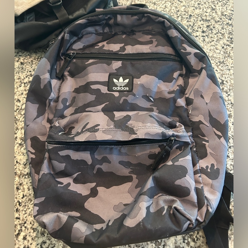 Adidas black and grey camo backpack.